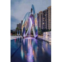 丽江主题街区 旋转圆环雕塑 水景灯光雕塑作品图